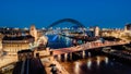 Newcastle Gateshead Quayside at night, with of Tyne Bridge and city skyline, long exposure with vibrant colours Royalty Free Stock Photo
