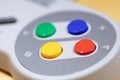 Retro gaming. Coloured buttons on a game controller no visible logos