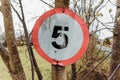 Newcastle UK:A damaged 5mph speed limit sign on a country road in England Royalty Free Stock Photo
