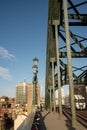 Newcastle UK: The famous Newcastle Tyne Bridge in Autumn with beautiful warm winter sunlight with Tesco truck crossing