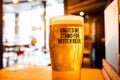 Newcastle UK - Oct 2021 - Pint of craft beer in a Brewdog bar, no logos. United We Stand for Better Beer caption on full