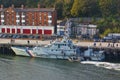 Newcastle, United Kingdom - October 5th, 2014 - UK border force cutter HMC Searcher at her moorings with RIB patrol boat coming al Royalty Free Stock Photo