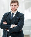 Newcomer businessman in a business suit stands near the window Royalty Free Stock Photo