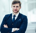 Newcomer businessman in a business suit stands near the window Royalty Free Stock Photo