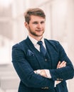 Newcomer businessman in a business suit stands near the window, Royalty Free Stock Photo