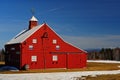 A Newer Bright Red Barn And White Mountains