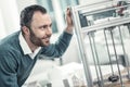 Happy nice engineer looking at the 3d printing machine Royalty Free Stock Photo