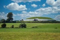 Newgrange passage tomb with nice clouds in the sky Royalty Free Stock Photo