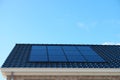 Newly build house in the Netherlands with solar panels attached on the roof against a sunny sky Close up of new building Royalty Free Stock Photo