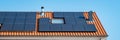 Newly build houses with solar panels attached on roof against a sunny sky Close up of solar pannel Royalty Free Stock Photo