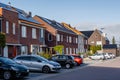 Newly build houses with solar panels attached on the roof against a sunny sky, housing market