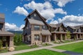 Newly build modern and rustic home from exterior in natural brown and grey colors with walkways, green grass and natural stone Royalty Free Stock Photo