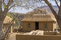 Newly built Basutho dwelling with grass thatch being installed