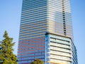 A newly built house. Glazed skyscraper. Reflection of the sky in the windows. Multi-apartment modern housing Royalty Free Stock Photo