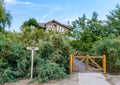 Newly built house in the middle of the woods surrounded by fence Royalty Free Stock Photo