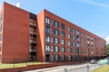 New brick partment building under blue sky in summer