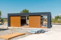 Newly built metal framed building with siding. Construction of a new tiny house. selective focus Royalty Free Stock Photo