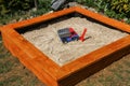 Newly built sandbox for small children in the garden