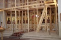 A newly constructed building of the church scaffolding cladding domes chandelier