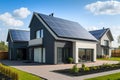 newly constructed homes with solar panels on the roof under a bright sky A close up of a brand new structure with dark solar