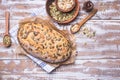 Newly fledged bread with pumpkin seeds on wooden table