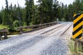 Newly graded gravel road over a bridge spanning the Little Popo Agie River outside of Lander, Wyoming