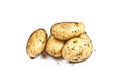 Newly harvested dirty potatoes heap isolated on white background