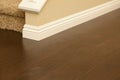 Newly Installed Brown Laminate Flooring and Baseboards in Home Royalty Free Stock Photo
