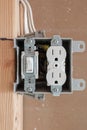 Newly installed electrical box with switch and outlet Royalty Free Stock Photo