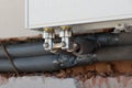 Newly laid pipes for heating. with a chiseled wall and radiator Royalty Free Stock Photo