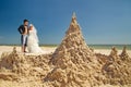 Newly-married couple enjoying on the beach