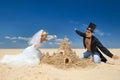 Newly-married couple enjoying on the beach