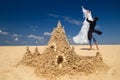 Newly-married couple enjoying o the beach Royalty Free Stock Photo