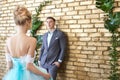 Newly married couple, loving couple before the wedding. Man and woman loving each other. Bride in the turquoise dress and groom Royalty Free Stock Photo