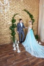 Newly married couple, loving couple before the wedding. Man and woman loving each other. Bride in the turquoise dress and groom Royalty Free Stock Photo