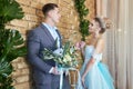 Newly married couple, loving couple before the wedding. Man and woman loving each other. Bride in the turquoise dress and groom Royalty Free Stock Photo