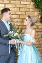 Newly married couple, loving couple before the wedding. Man and woman loving each other. Bride in the turquoise dress and groom Royalty Free Stock Photo