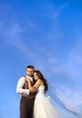 Newly married couple portrait with blue sky Royalty Free Stock Photo