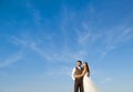 Newly married couple portrait with blue sky Royalty Free Stock Photo