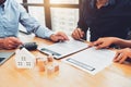 Newly married couple signing contract agreement document for mortgage new house after wedding. Happy family and real estate Royalty Free Stock Photo