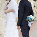 Newly married couple walking in rainy day Royalty Free Stock Photo