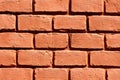 Newly painted old red brick suburban family house wall texture
