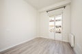 Newly painted room with bay window, wooden floors, radiator and black Royalty Free Stock Photo