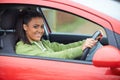 Newly Qualified Teenage Girl Driver Sitting In Car