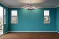 Newly Remodeled Room of House with Wood Floors, Moulding, Rich Blue Paint and Ceiling Lights