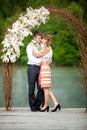 Newly wed couple embracing next to a lake Royalty Free Stock Photo