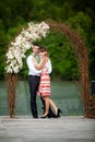 Newly wed couple embracing next to a lake Royalty Free Stock Photo