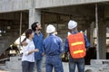 Newly wed couple is meeting with engineering contractor at their under construction house to inspect the building progress and Royalty Free Stock Photo