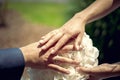 Wedding couple, holding their rings in the camera.