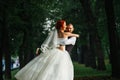 Newly wed husband spinning wife around in the dark alley Royalty Free Stock Photo